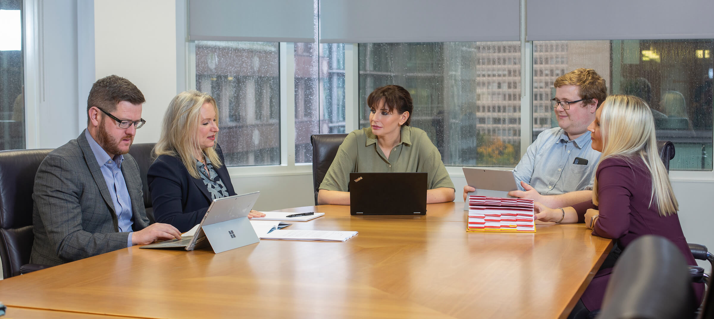 Photo of the L&M MediLaw solicitors discussing a clinical negligence case